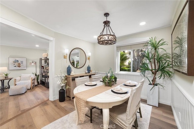 dining room featuring wood finished floors and recessed lighting
