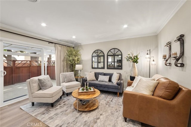 living area featuring wood finished floors, recessed lighting, and ornamental molding