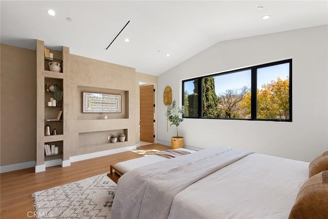 bedroom with light wood-style floors, recessed lighting, baseboards, and vaulted ceiling