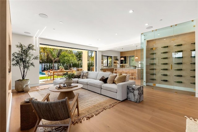 living area featuring recessed lighting and light wood-style floors