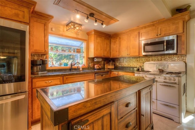 13730 Nimshew Rd, Magalia, CA 95954 - kitchen with stainless steel microwave, a kitchen island, white range with gas stovetop, decorative backsplash, and a sink