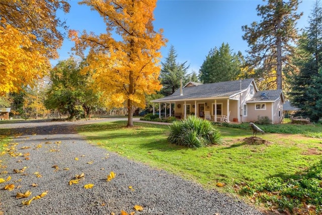 13730 Nimshew Rd, Magalia, CA 95954 - view of front of house with gravel driveway, a porch, and a front yard
