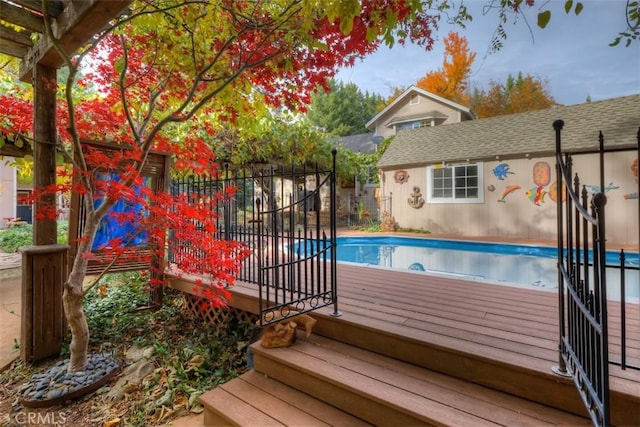 13730 Nimshew Rd, Magalia, CA 95954 - view of swimming pool with a fenced in pool, a wooden deck, and fence