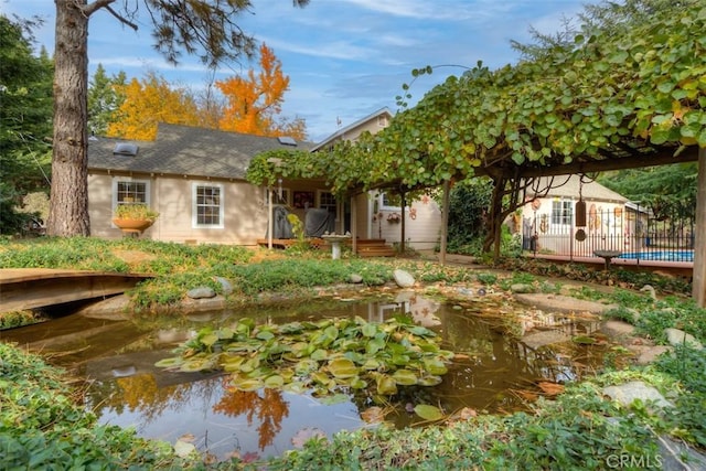 13730 Nimshew Rd, Magalia, CA 95954 - back of house with fence and a small pond