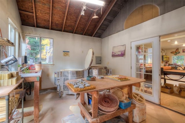 13730 Nimshew Rd, Magalia, CA 95954 - dining space with electric panel, lofted ceiling, and concrete flooring