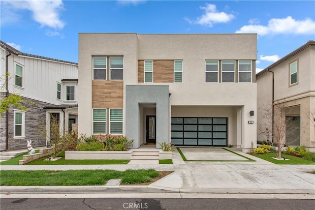 121 Mulberry, Lake Forest, CA 92630 - view of front of property featuring driveway, stucco siding, and an attached garage