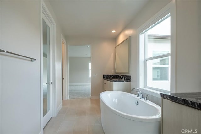 121 Mulberry, Lake Forest, CA 92630 - full bathroom with a freestanding bath, vanity, tile patterned floors, and recessed lighting