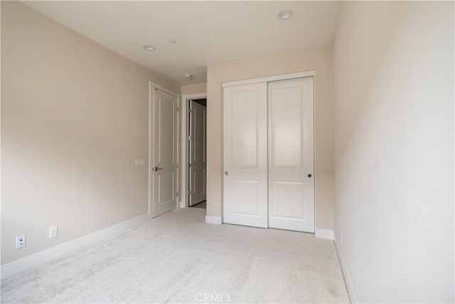 121 Mulberry, Lake Forest, CA 92630 - unfurnished bedroom featuring light carpet and a closet