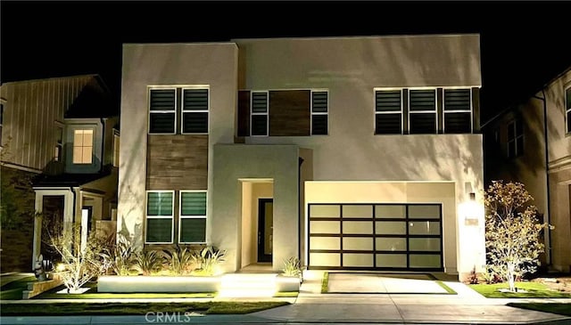 121 Mulberry, Lake Forest, CA 92630 - view of front of home with driveway, stucco siding, and a garage