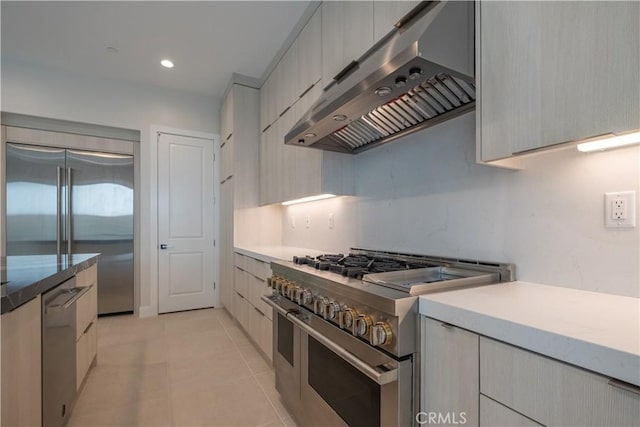 121 Mulberry, Lake Forest, CA 92630 - kitchen with premium appliances, exhaust hood, modern cabinets, light tile patterned flooring, and recessed lighting