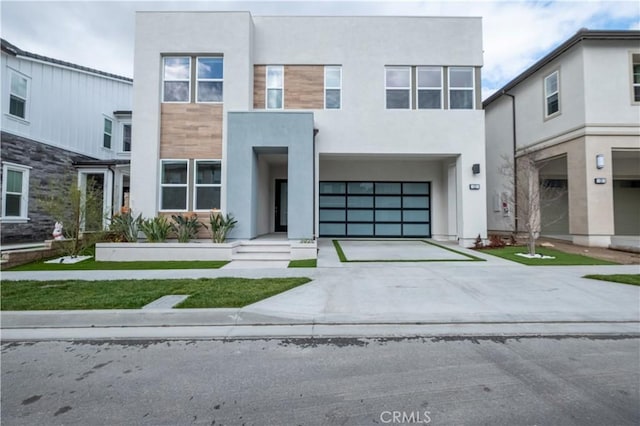 121 Mulberry, Lake Forest, CA 92630 - view of front of property featuring stucco siding, concrete driveway, and an attached garage