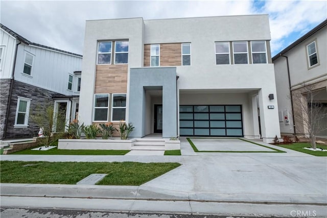 121 Mulberry, Lake Forest, CA 92630 - view of front of house featuring stucco siding, driveway, and an attached garage