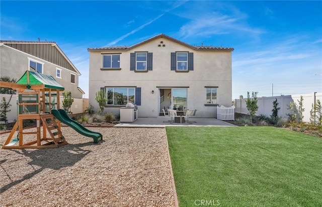 29754 Laurel Ct, Menifee, CA 92584 - back of house featuring stucco siding, a lawn, a playground, and fence