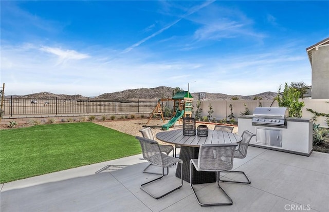 29754 Laurel Ct, Menifee, CA 92584 - view of patio / terrace with outdoor dining space, exterior kitchen, area for grilling, and a mountain view