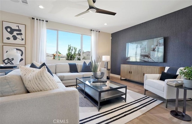 29754 Laurel Ct, Menifee, CA 92584 - living area with an accent wall, radiator, light wood-style floors, and recessed lighting