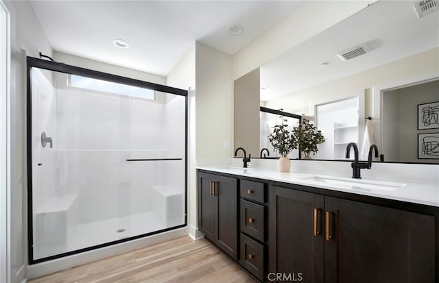29754 Laurel Ct, Menifee, CA 92584 - full bath with wood finished floors, a stall shower, and double vanity