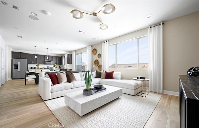 29754 Laurel Ct, Menifee, CA 92584 - living room with light wood finished floors and recessed lighting