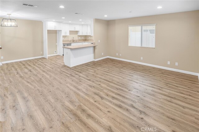 1109 N Mulberry, Compton, CA 90222 - unfurnished living room with light wood-style floors and recessed lighting