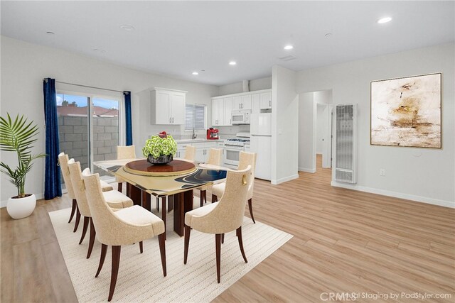 1109 N Mulberry, Compton, CA 90222 - dining space with a heating unit, light wood-style flooring, and recessed lighting