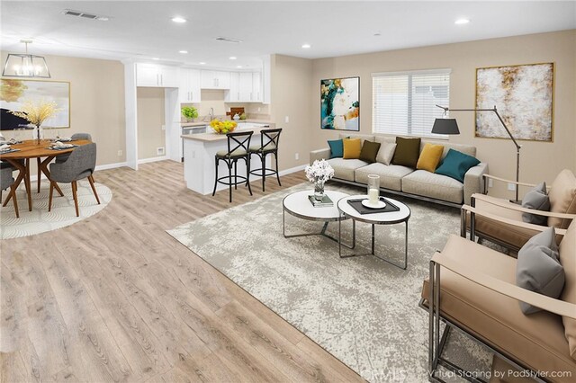 1109 N Mulberry, Compton, CA 90222 - living room featuring light wood finished floors and recessed lighting