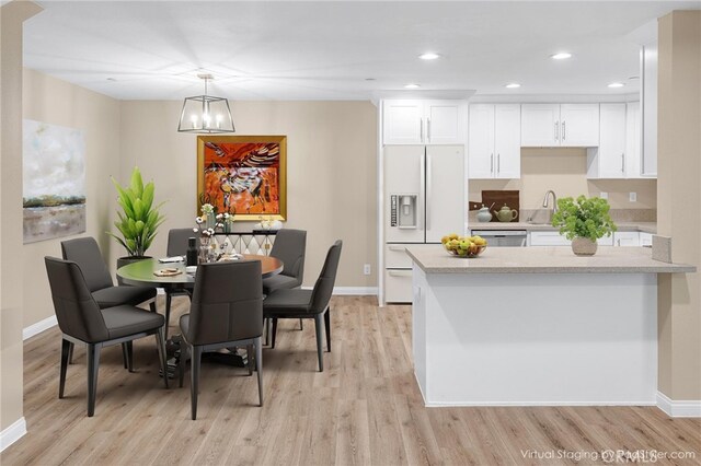 1109 N Mulberry, Compton, CA 90222 - dining space with light wood-style floors, recessed lighting, and a chandelier