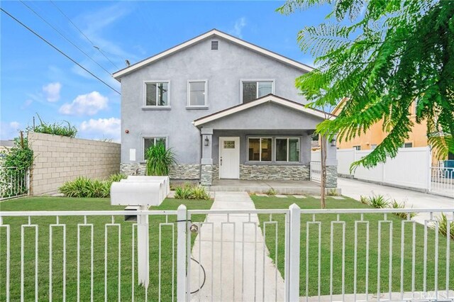 1109 N Mulberry, Compton, CA 90222 - view of front facade with a fenced front yard, covered porch, stone siding, stucco siding, and a gate