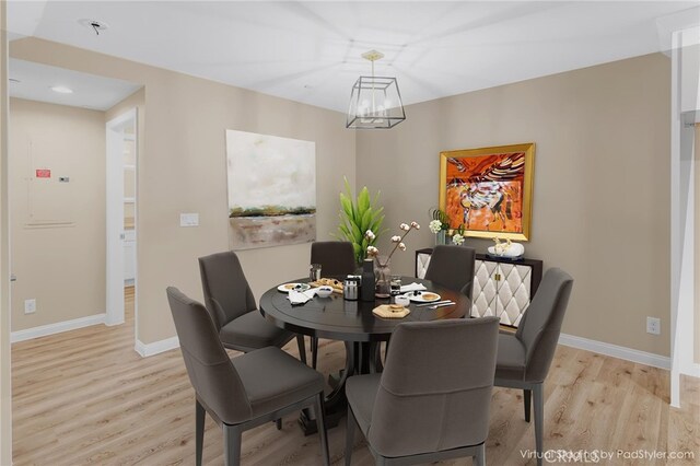 1109 N Mulberry, Compton, CA 90222 - dining space with light wood finished floors and a chandelier