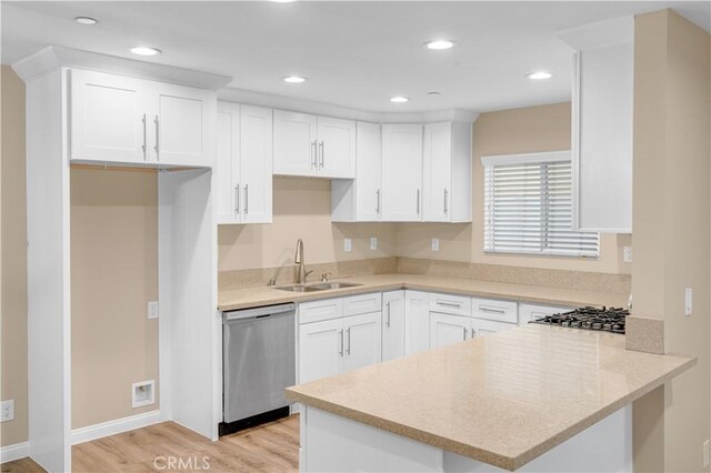 1109 N Mulberry, Compton, CA 90222 - kitchen with appliances with stainless steel finishes, a peninsula, light wood finished floors, white cabinetry, and recessed lighting