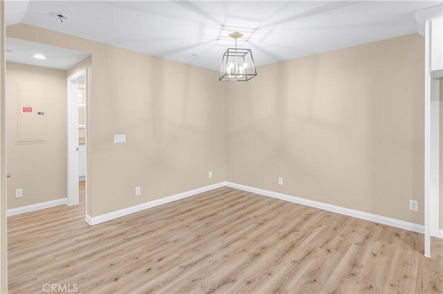 1109 N Mulberry, Compton, CA 90222 - empty room featuring light wood finished floors, electric panel, a chandelier, and recessed lighting