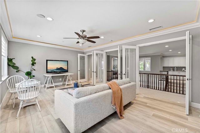 3905 Elderberry Cir, Corona, CA 92882 - living room featuring ornamental molding, baseboards, light wood finished floors, visible vents, and ceiling fan