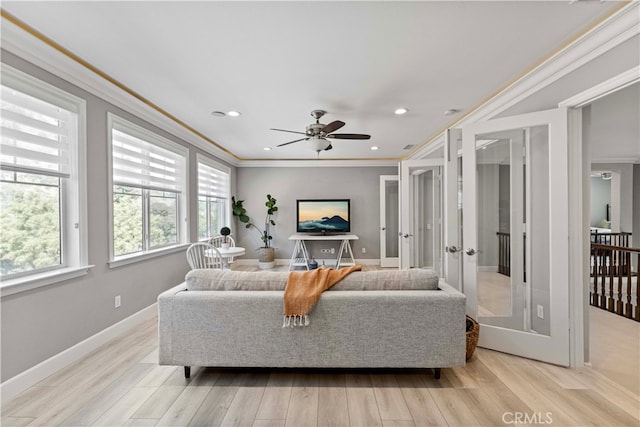 3905 Elderberry Cir, Corona, CA 92882 - living room with crown molding, french doors, a ceiling fan, light wood finished floors, and baseboards