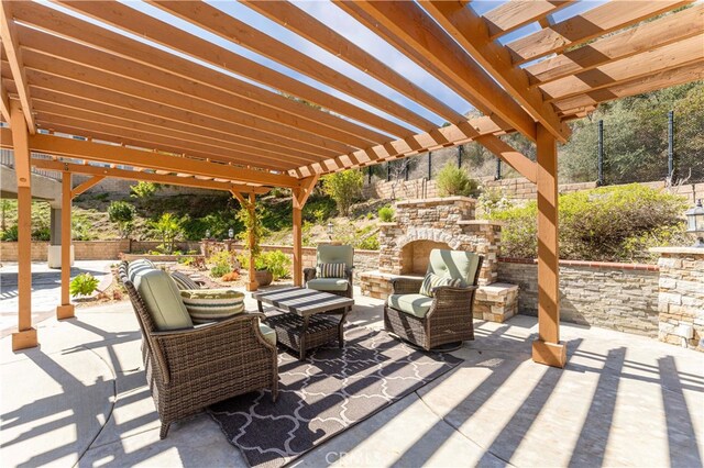 3905 Elderberry Cir, Corona, CA 92882 - view of patio / terrace with an outdoor living space with a fireplace, a pergola, and fence
