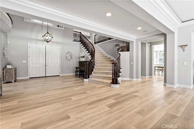 3905 Elderberry Cir, Corona, CA 92882 - foyer entrance featuring crown molding, stairway, baseboards, light wood-style floors, and recessed lighting