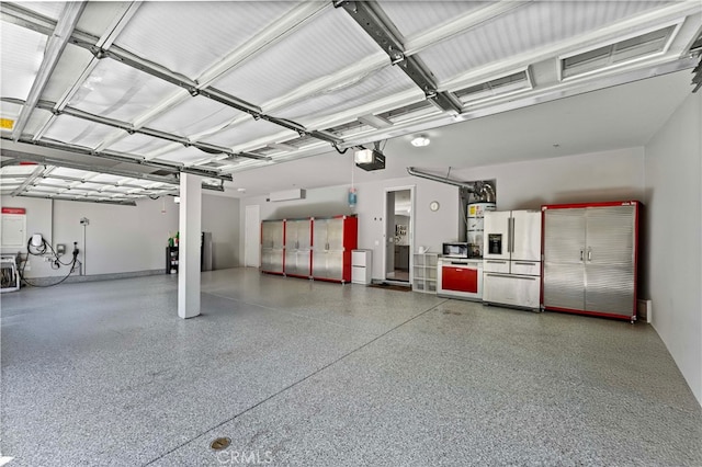 3905 Elderberry Cir, Corona, CA 92882 - garage with a garage door opener and stainless steel refrigerator with ice dispenser