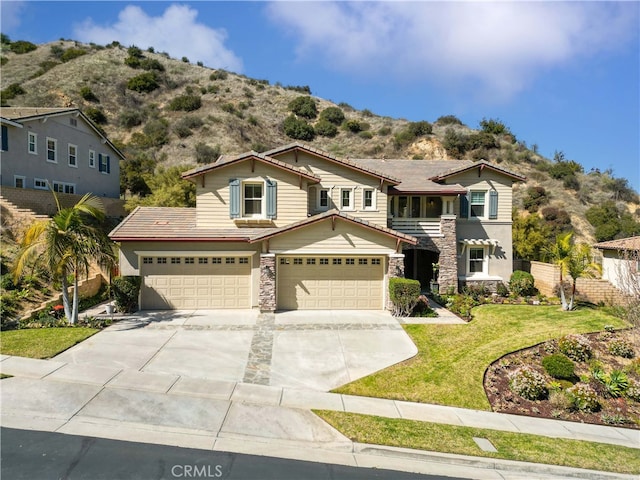 3905 Elderberry Cir, Corona, CA 92882 - traditional home with concrete driveway, fence, an attached garage, stone siding, and a front lawn