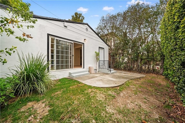 7116 Waring Ave, Los Angeles, CA 90046 - rear view of house with a patio area, stucco siding, and fence