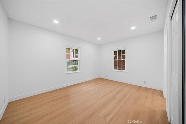 7116 Waring Ave, Los Angeles, CA 90046 - spare room with visible vents, recessed lighting, light wood-type flooring, and baseboards