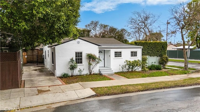 7116 Waring Ave, Los Angeles, CA 90046 - view of front facade featuring a gate, stucco siding, and fence