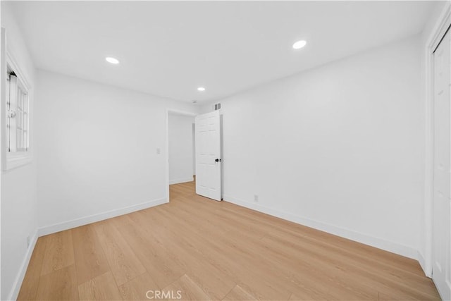 7116 Waring Ave, Los Angeles, CA 90046 - unfurnished room with light wood finished floors, visible vents, recessed lighting, and baseboards