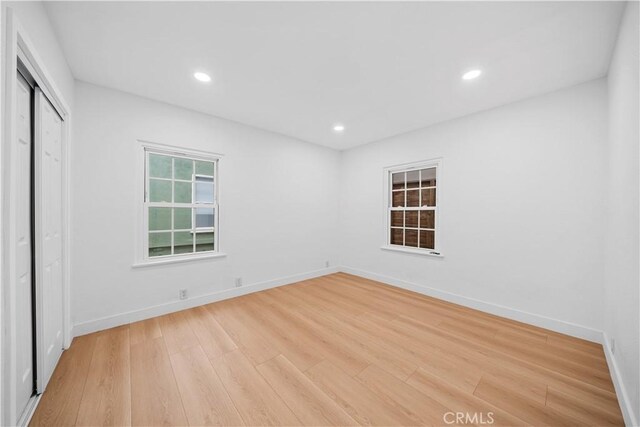 7116 Waring Ave, Los Angeles, CA 90046 - spare room featuring recessed lighting, light wood-type flooring, and baseboards