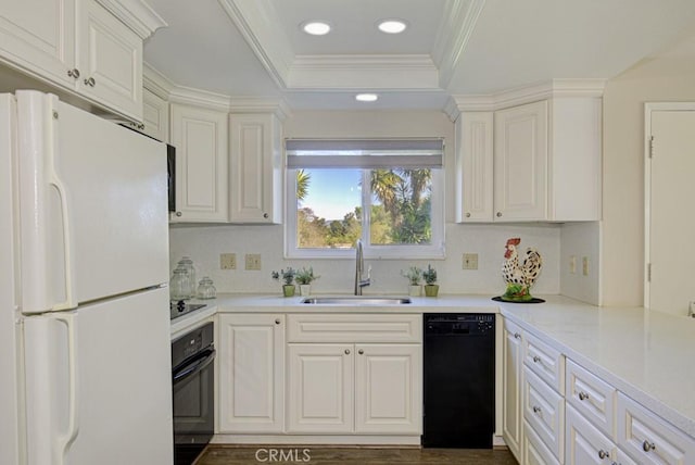 5 Via Castilla Unit B, Laguna Woods, CA 92637 - kitchen with black appliances, tasteful backsplash, recessed lighting, crown molding, and a tray ceiling