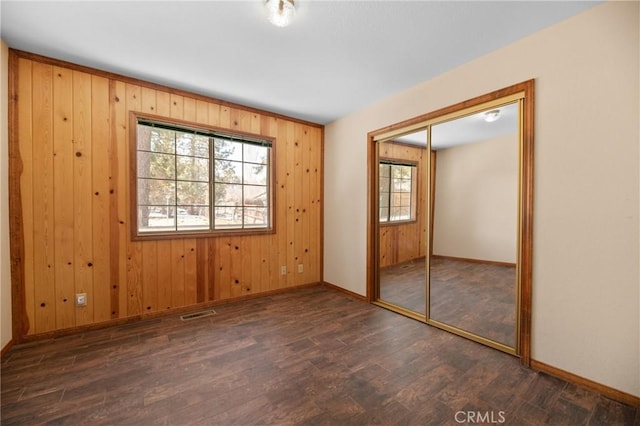 252 Riverside Ave, Sugarloaf, CA 92386 - unfurnished bedroom with a closet, baseboards, and wood finished floors