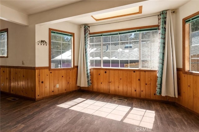 252 Riverside Ave, Sugarloaf, CA 92386 - unfurnished room with visible vents, wooden walls, and wainscoting