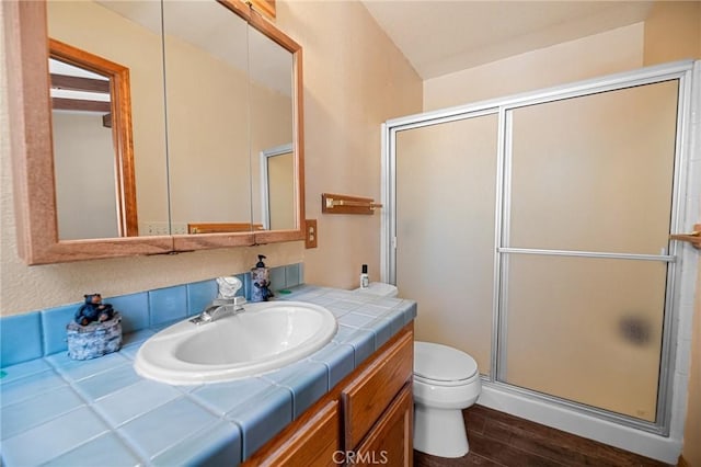 252 Riverside Ave, Sugarloaf, CA 92386 - bathroom with toilet, a stall shower, vanity, and wood finished floors