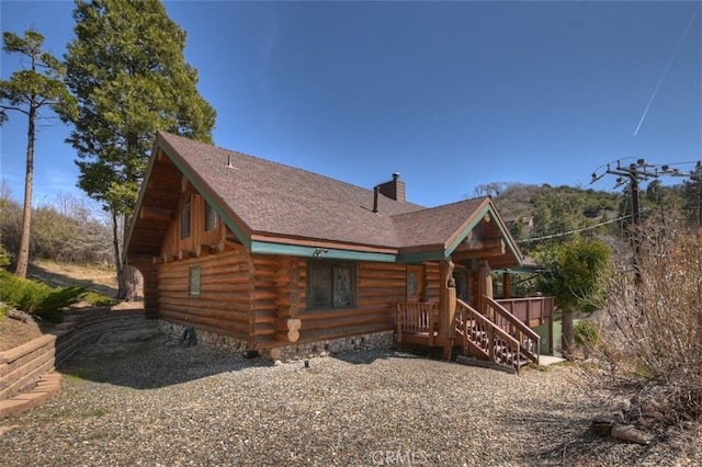 29632 Hook Creek Rd, Cedar Glen, CA 92321 - back of property with log exterior, a chimney, and roof with shingles