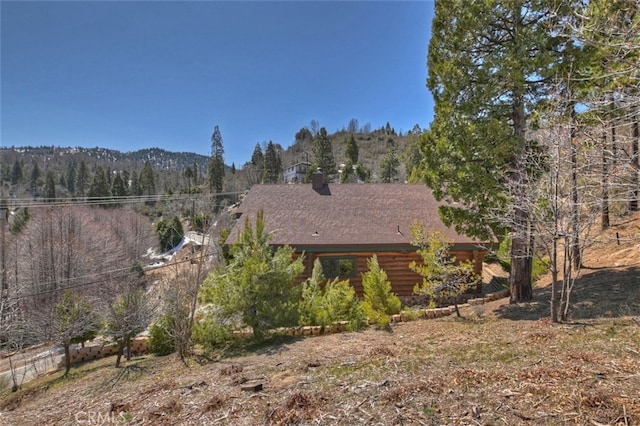 29632 Hook Creek Rd, Cedar Glen, CA 92321 - view of front of property with a wooded view, log siding, and a chimney