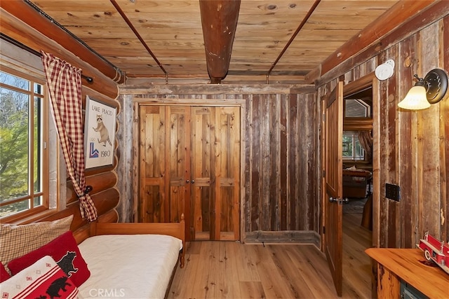 29632 Hook Creek Rd, Cedar Glen, CA 92321 - bedroom with a wooden ceiling with exposed beams, hardwood / wood-style floors, and wooden walls