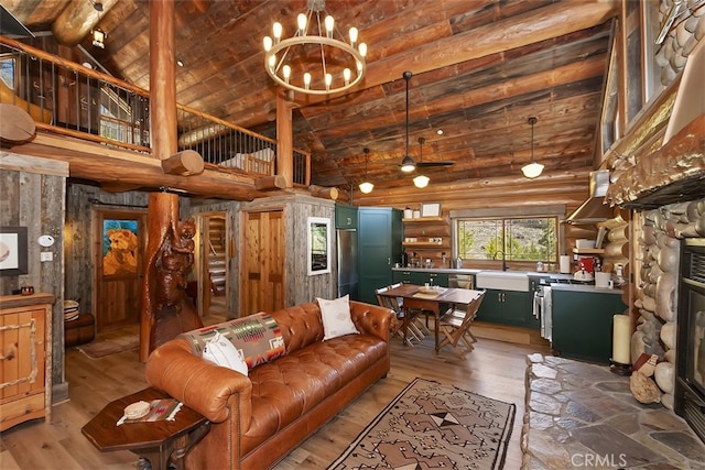 29632 Hook Creek Rd, Cedar Glen, CA 92321 - living room featuring high vaulted ceiling, light wood-type flooring, a chandelier, a ceiling fan, and log walls