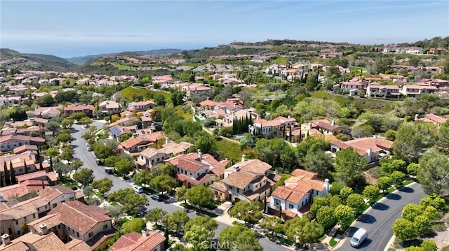 birds eye view of property with a residential view