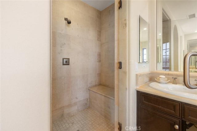 full bath with a stall shower, vanity, tile patterned flooring, and visible vents